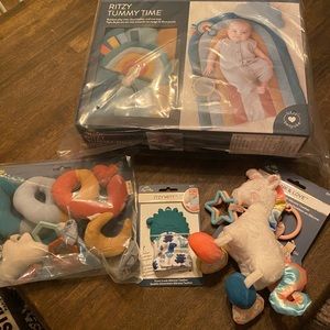 Itzy Ritzy tummy time, teething mitt, plush teething toy, and travel toy